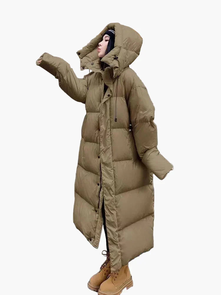Damen Winter Steppmantel, oversized und lang, bietet urbanen Stil und maximalen Komfort für kalte Tage.