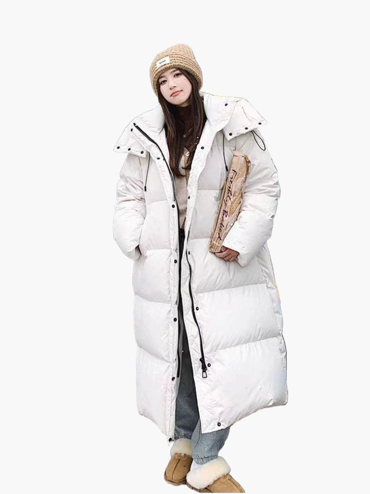Eleganter, langer Damen Steppmantel mit modernem Steppdesign, perfekt als warme Winterjacke für Freizeit.