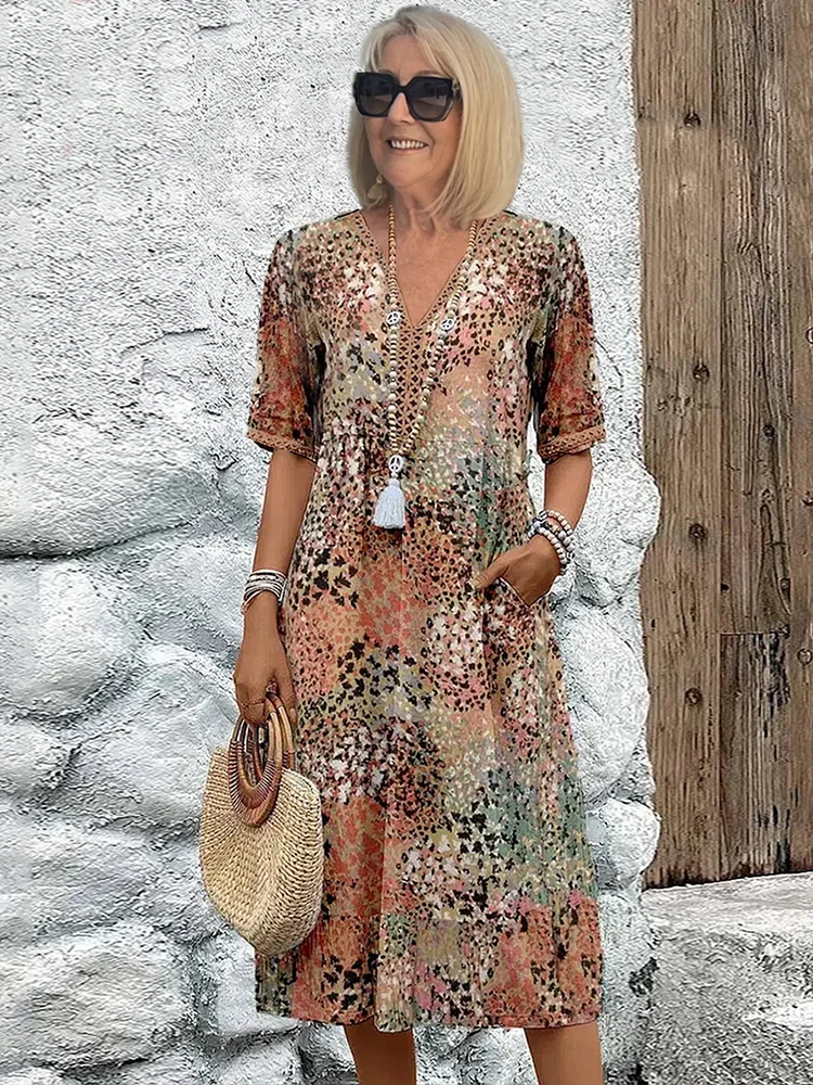 Lebendiges Damen Midikleid mit bunten Mustern, elegant & bequem. Ideal für Frühling & Sommer, jeden Anlass.