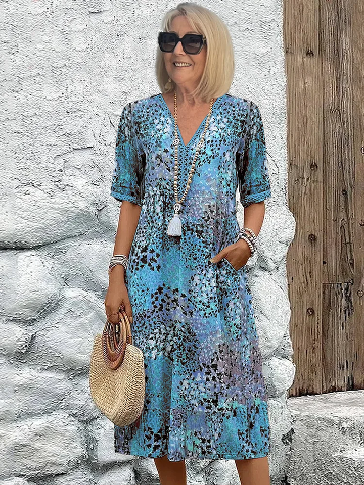 Elegantes & stilvolles Damen Midikleid mit buntem Muster, festlich und komfortabel. Ideal für besondere Anlässe.