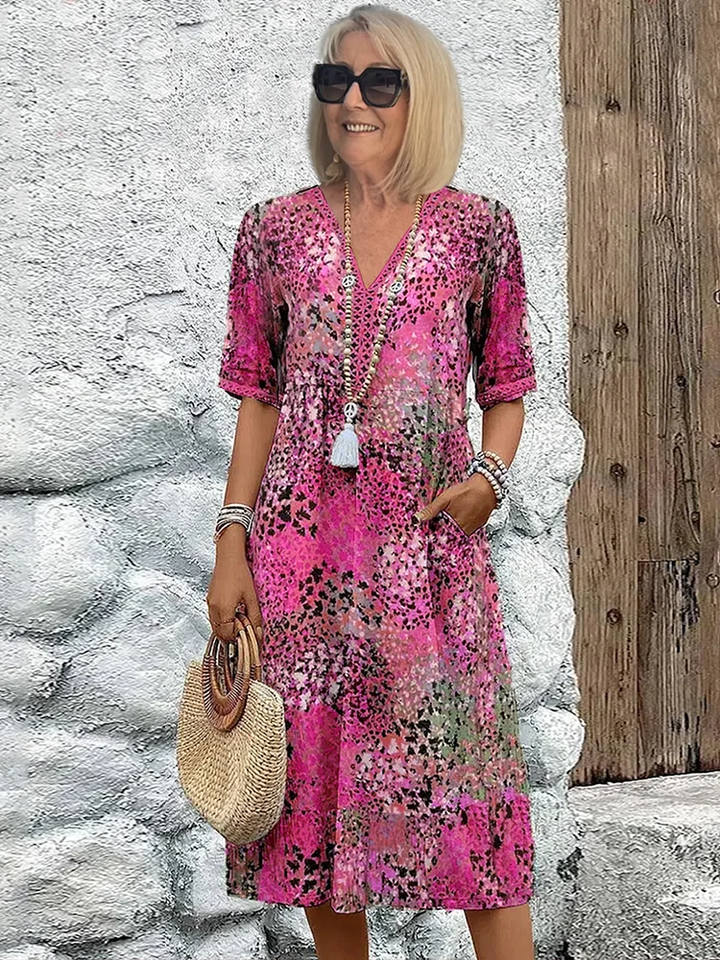 Fließendes Damen Midikleid, lebendige Farben, feminine Silhouette. Komfortabel für stilvolle Frühlings- und Herbstmode.