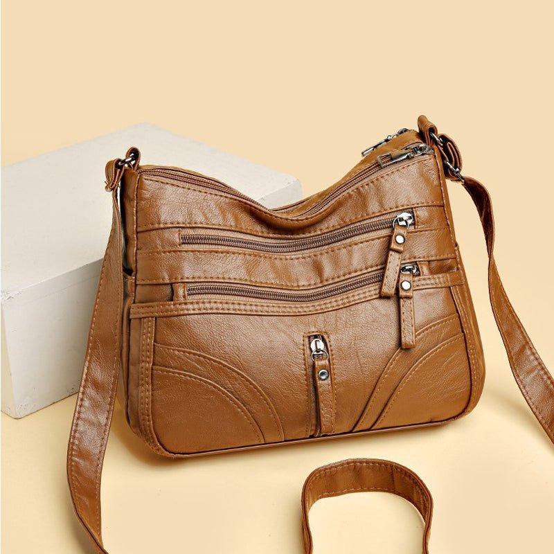 Praktische Vintage Damentasche mit vielen Fächern, ideal als Schultertasche für Organisation im Alltag.