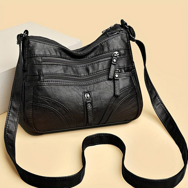 Robuste Vintage Freizeittasche für Damen, als Umhängetasche oder Schultertasche tragbar, langlebig.