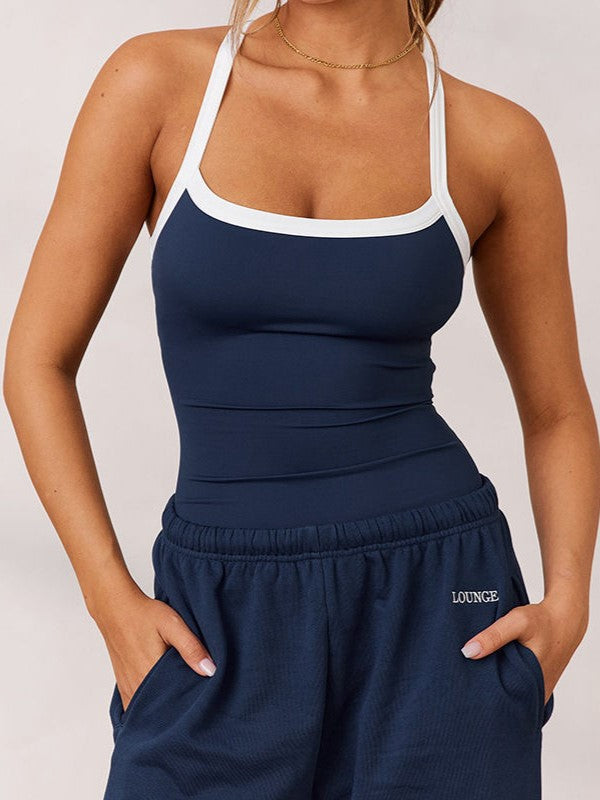 Marineblaues Vintage Haltertop für Damen mit eleganten Patchwork-Details; ideal für Sommeroutfits.