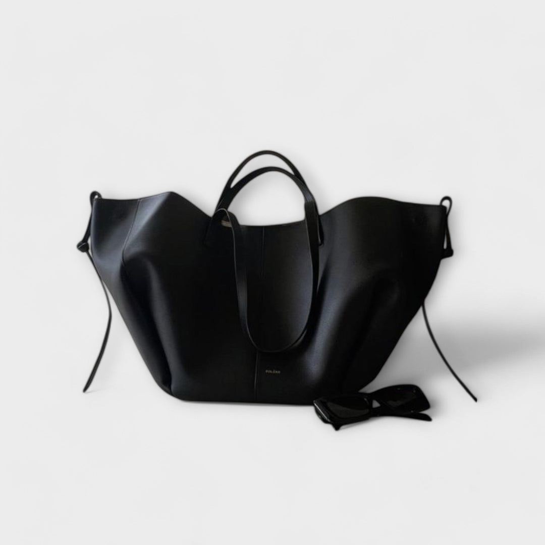 Schwarze moderne Damen-Handtasche mit hochwertigem Material und praktischer Aufteilung für den Alltag.