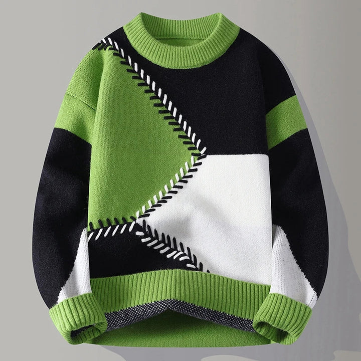 Moderner Herren Langarm-Pullover mit innovativem Color-Blocking und feinem strukturiertem Strickmuster. Eleganter Winter-Style.