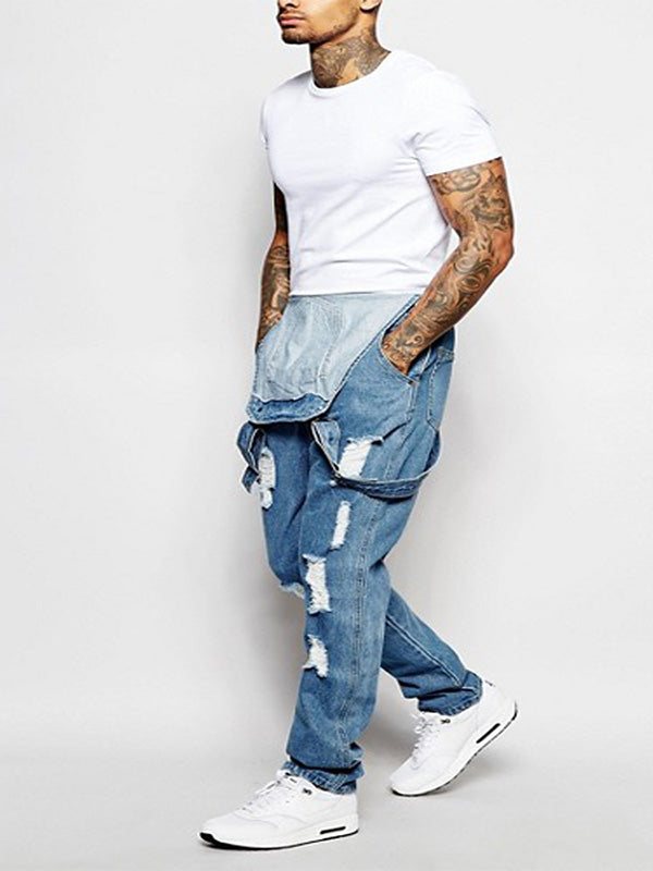 Lässiger Damen Jeans Overall im Used Look, zerrissen. Schmale Passform für modische Freizeit-Looks.