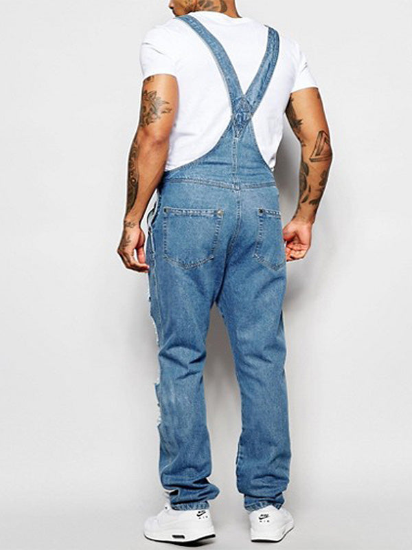 Trendiger Damen Denim Overall mit zerrissenen Details, schmal geschnitten und praktischen 5 Taschen.