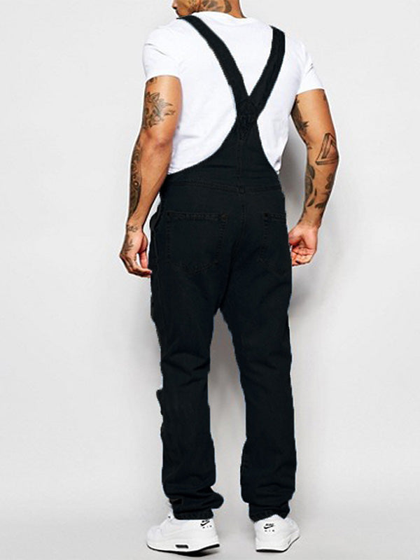 Schmal geschnittener Damen Overall aus Denim mit zerrissenen Details, Used Look & 5 praktischen Taschen.