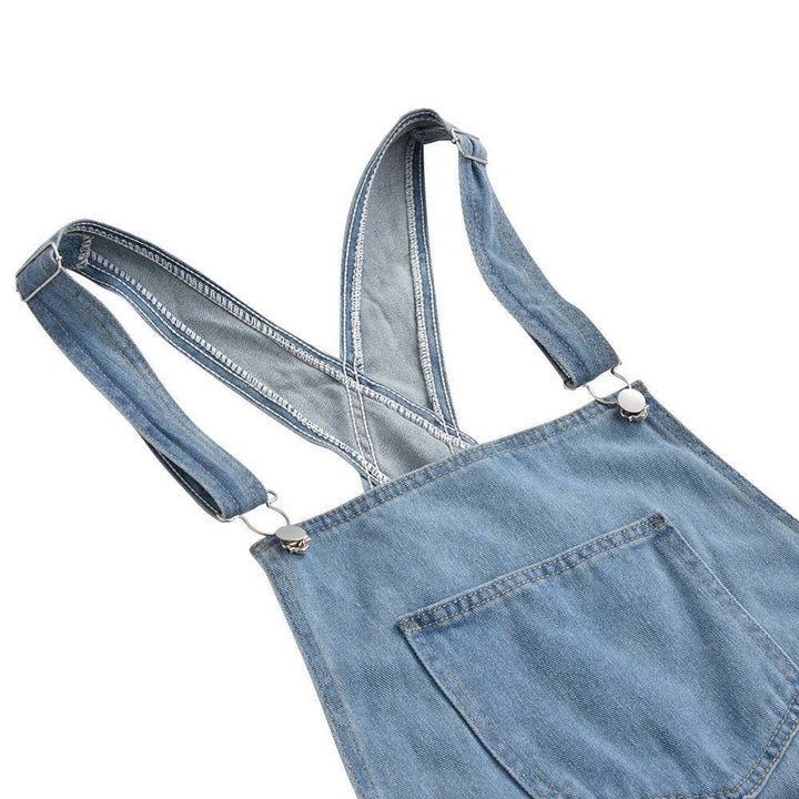 Moderner Damen Denim Overall mit Rissen und Used Look. Schmaler Schnitt und 5 Taschen.