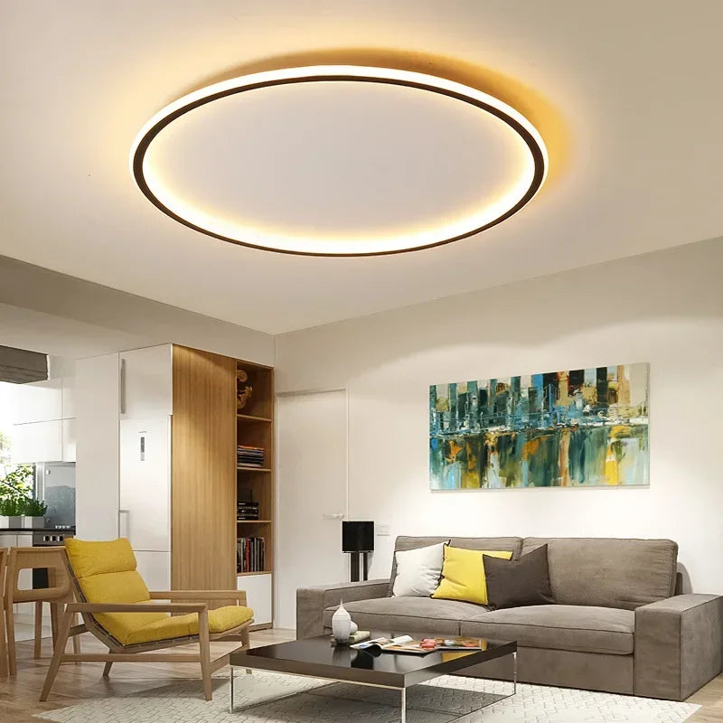 Runde LED-Deckenleuchte im skandinavischen Stil, aus Metall und Glas, mit sanfter Beleuchtung für moderne Wohnräume.