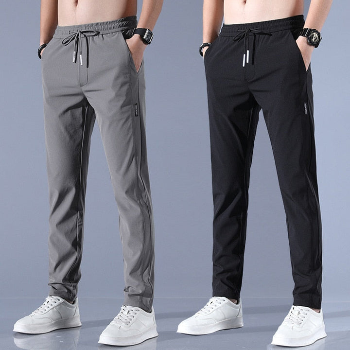 "Schnelltrocknende Herren-Stretchhose mit elastischem Material in Grau, ideal für aktive Männer, modernes Design, atmungsakti