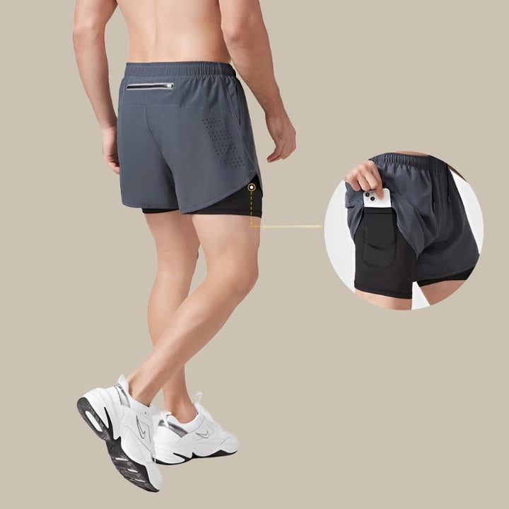 "Schnelltrocknende Herrenlaufshorts, dunkelgrau, mit Taschen und Mesh-Einsätzen für Atmungsaktivität und Bewegungsfreiheit."