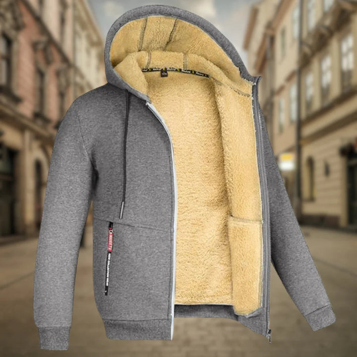Grüne Outdoor-Kapuzenjacke für Herren, robust und warm, perfekt gegen Kälte bei Aktivitäten.