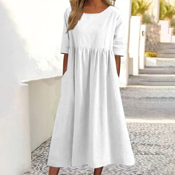 Modernes Damen Sommerkleid mit Rundhalsausschnitt, Kurzarm. Bequemer Schnitt und praktische Taschen.