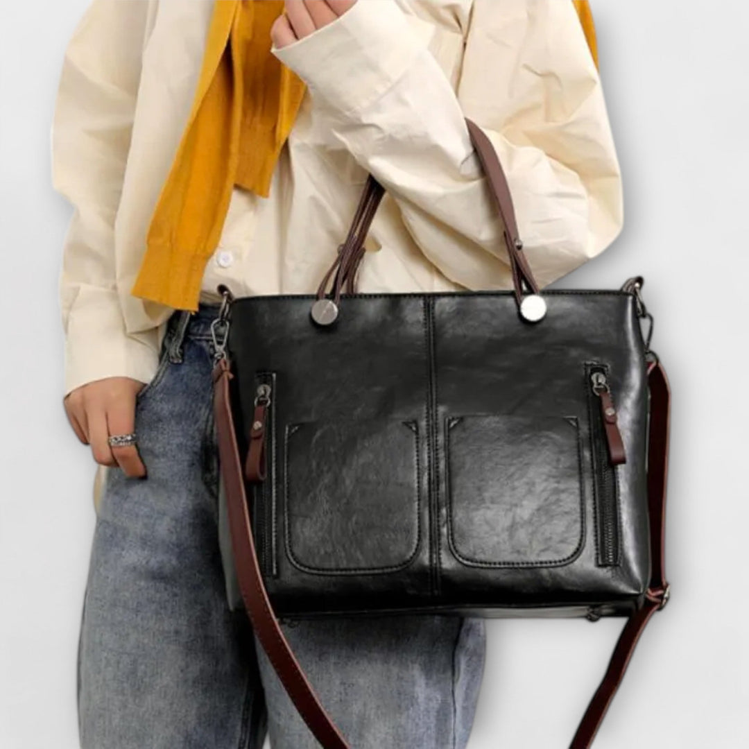 Schwarze Damen-Handtasche, stilvoll und praktisch. Ideal für den Alltag und Sommertage, als Schultertasche.