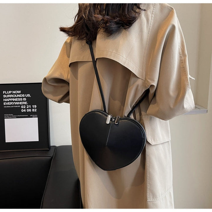 Modische Damen Umhängetasche mit sicherem Reißverschlussfach hinten. Bequeme Crossbody Tasche.