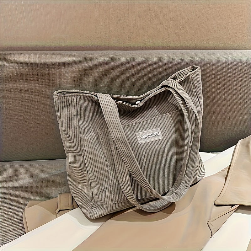 Elegante hellgraue Umhängetasche für Damen, ideal als praktische Alltagstasche & Organisationstalent. Modisches Accessoire.