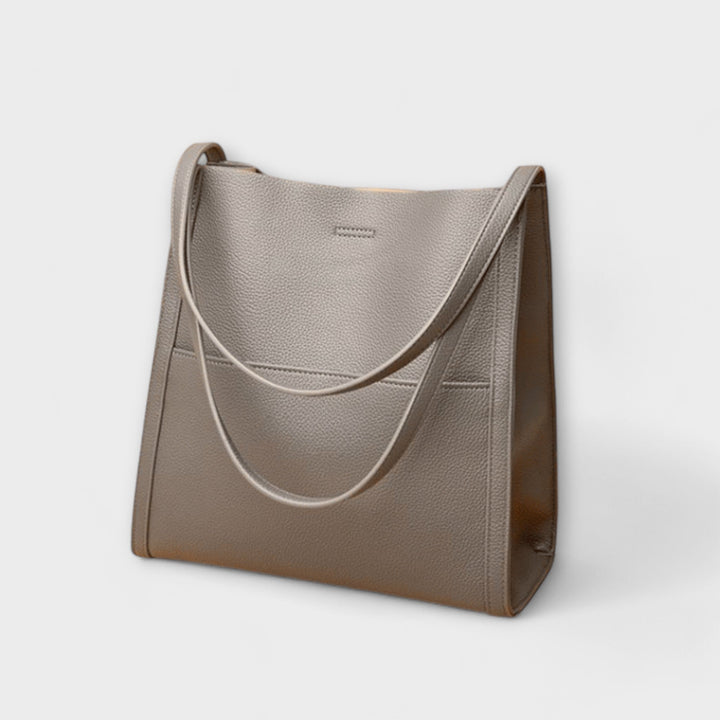 Stilvolle Damenhandtasche mit Struktur, modernes Design, vielseitig einsetzbar für den Alltag.