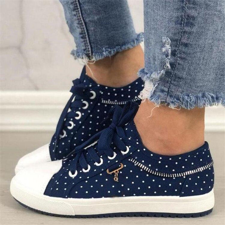 Damen Sneakers in Dunkelblau mit weißer Kappe und Punkten