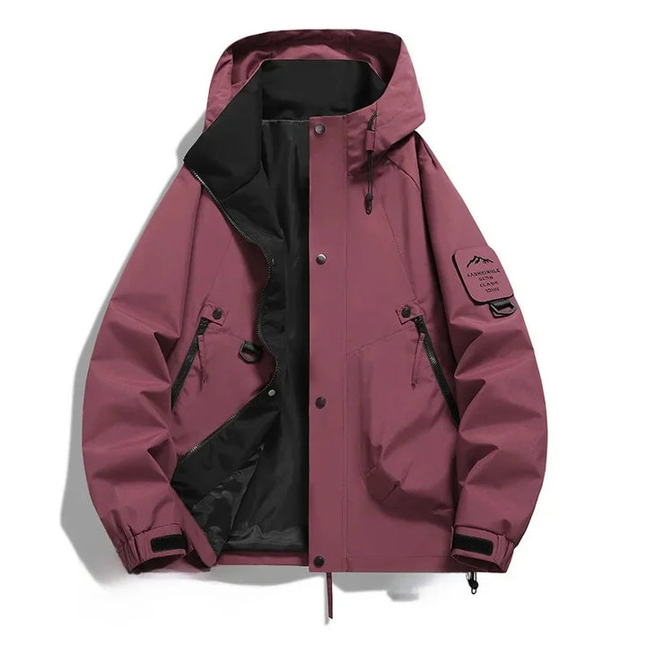 Robuste Unisex Skijacke mit Kapuze, wind- & wasserdicht, als obere Schicht für extreme Winterbedingungen im Schnee.