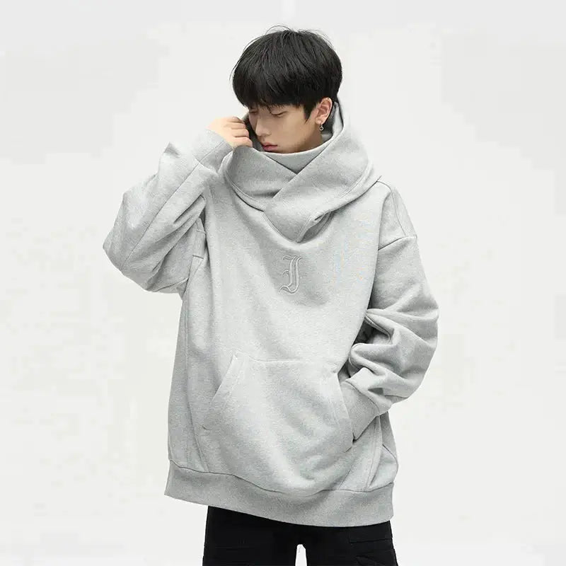 Unisex Ninja-Jacke mit Doppelkragen in Schwarz, asymmetrisch geschnitten, ideal für urbanen Herbst- & Winter-Streetwear.
