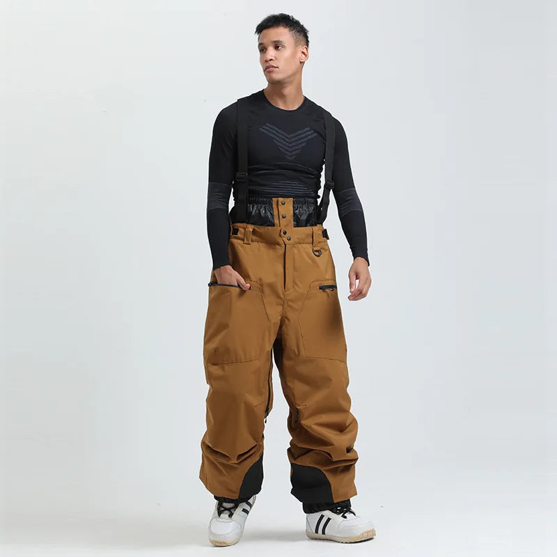 Gedeckte Unisex Skihose mit Hosenträgern, wasserdicht und warm, ideal für Wintersport & Kälteschutz.