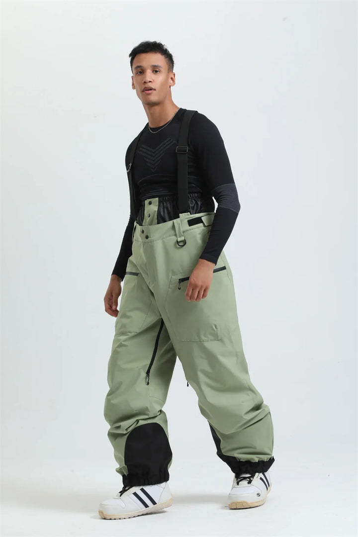 Moderne Unisex Skihose in Grau mit Hosenträgern, wasserdicht & extrem warm für Damen und Herren im Schnee.